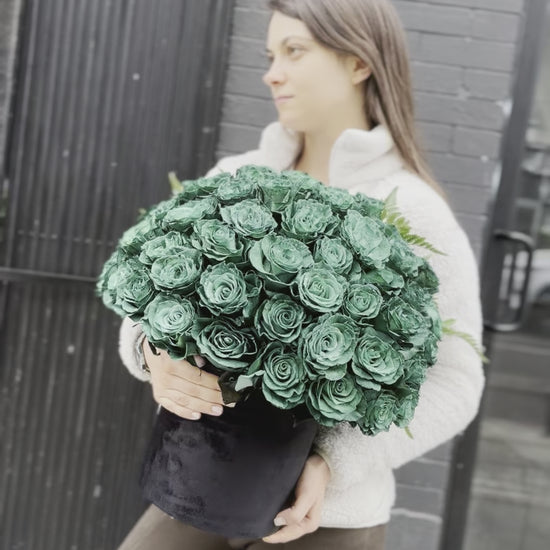 Full view of the Green Roses in Black Velvet Box, styled against a dark backdrop to emphasize the rich color and premium presentation.
