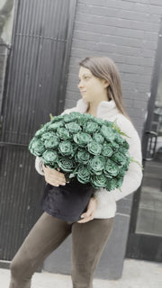 Full view of the Green Roses in Black Velvet Box, styled against a dark backdrop to emphasize the rich color and premium presentation.
