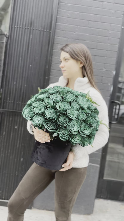 Full view of the Green Roses in Black Velvet Box, styled against a dark backdrop to emphasize the rich color and premium presentation.
