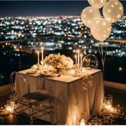 Rooftop private dinner setup with candles and balloons, Los Angeles event florist