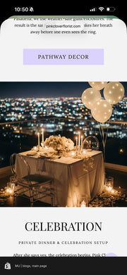 Private rooftop dinner celebration setup with ivory rose centerpiece, taper candles, ghost chairs, balloon cluster, and night Los Angeles city skyline.