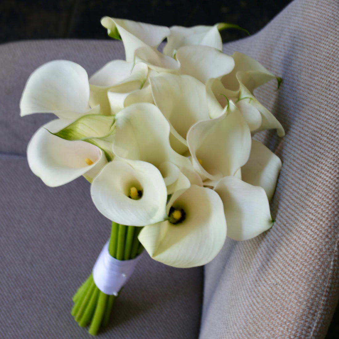 Elegant bouquet of white roses with soft green accents, ideal for serene celebrations