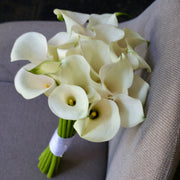 Elegant bouquet of white roses with soft green accents, ideal for serene celebrations