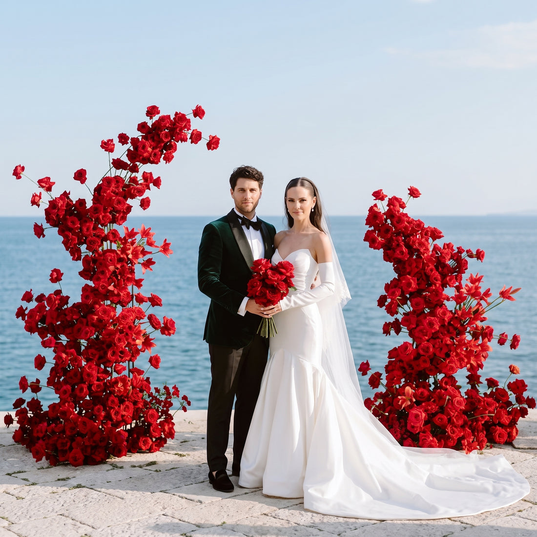 Red rose floral columns at an oceanfront wedding ceremony — Los Angeles wedding florist, Pink Clover