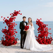 Red rose floral columns at an oceanfront wedding ceremony — Los Angeles wedding florist, Pink Clover