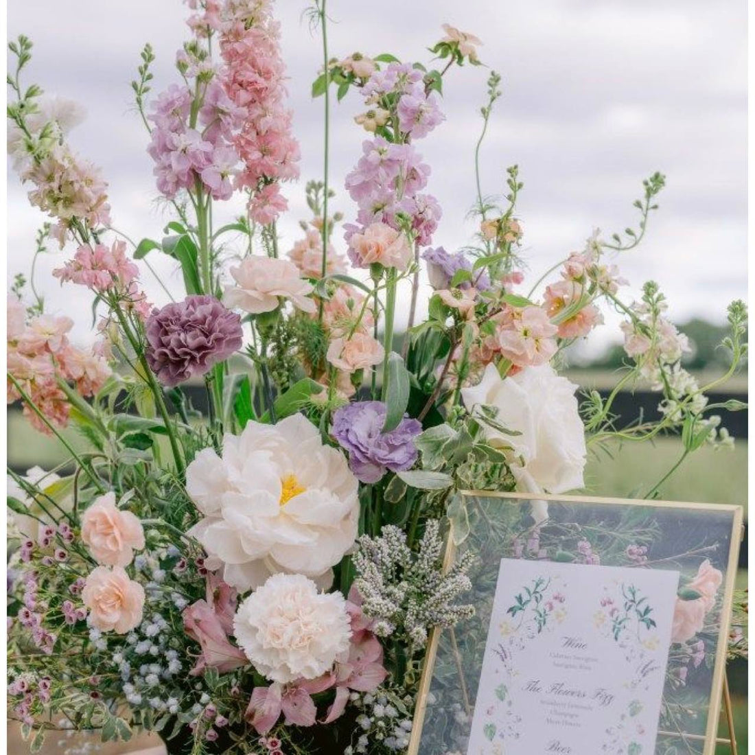 Romantic blush bar centerpiece with pink stocks and peonies for Los Angeles events