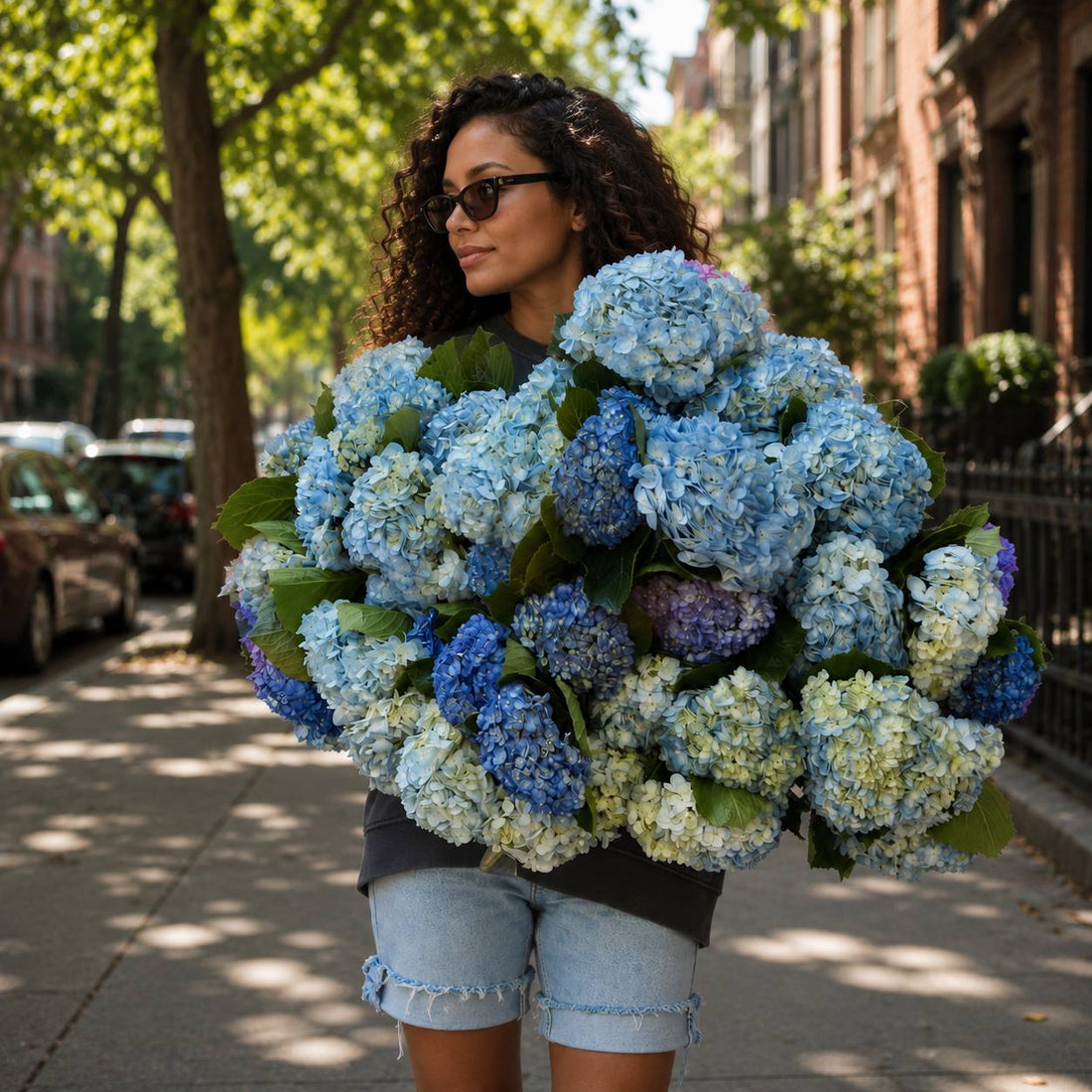 Sapphire Dreams blue and lilac hydrangea bouquet held on a Los Angeles street — Pink Clover
