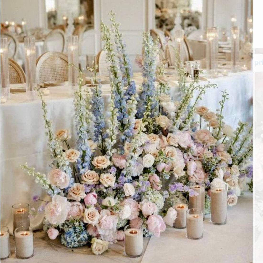 Sweetheart table floor installation with peonies roses and candles for Los Angeles ballroom weddings