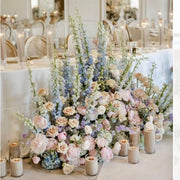 Sweetheart table floor installation with peonies roses and candles for Los Angeles ballroom weddings