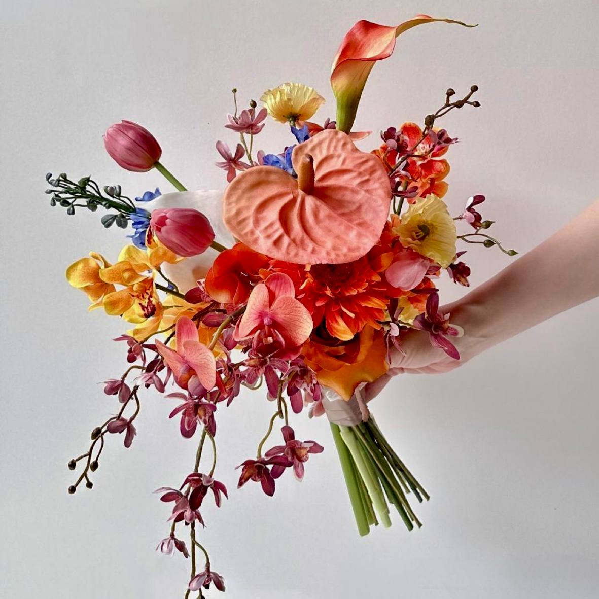 Vibrant tropical bouquet with orchids anthuriums calla lilies and exotic blooms by Pink Clover Flowers Los Angeles