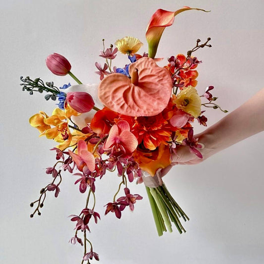 Vibrant tropical bouquet with orchids anthuriums calla lilies and exotic blooms by Pink Clover Flowers Los Angeles