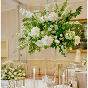 White garden tall centerpiece with roses and delphinium in trumpet vase for Los Angeles weddings
