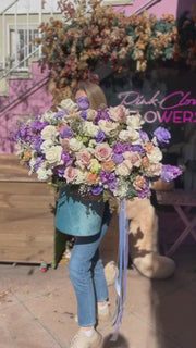 Thoughtful floral gift with fresh blooms arranged in a calming palette, ideal for comfort and sympathy occasions