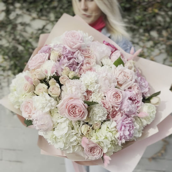 Handcrafted Milana floral gift with fresh blooms presented in a精致 glass vase for a refined and memorable presentation