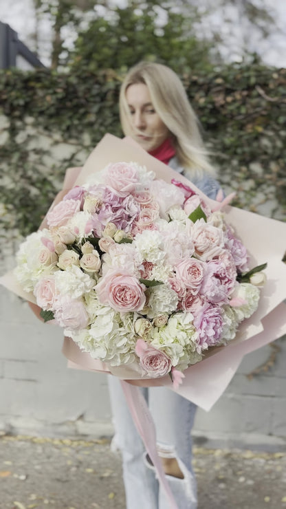 Handcrafted Milana floral gift with fresh blooms presented in a精致 glass vase for a refined and memorable presentation