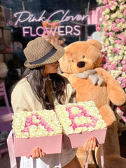 Flower Initial arrangement styled in setting - luxury flower box Los Angeles florist