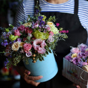 Flowers & Macarons arrangement styled in setting - luxury flower box Los Angeles florist