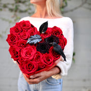 Handcrafted Raven Heart bouquet showcasing rich colors and hauntingly beautiful floral design, beautifully presented for seasonal gifting