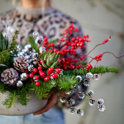 Elegant Winterberry bouquet with red berries and decorative succulents, beautifully presented for pr