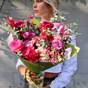 Vibrant purple rose bouquet with fresh seasonal flowers, beautifully styled for romantic occasions and luxury delivery