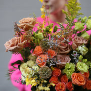 Fresh floral gift filled with sunny blooms, styled beautifully in a natural, hand-tied presentation for a joyful look