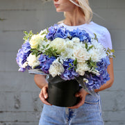 Dora arrangement styled in setting - luxury flower box Los Angeles florist