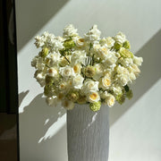 Elegant white and beige rose arrangement styled in a minimalist high vase design, ideal for modern home décor and premium delivery