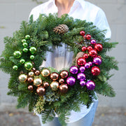 Elegant 15-inch Christmas wreath featuring natural greenery and festive accents, ideal for seasonal home décor