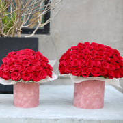 Close-up of vibrant red roses in a velvet box, showcasing the depth of color and high-quality craftsmanship