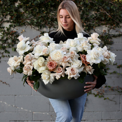 Handcrafted Majestic floral gift with soft-toned roses in a sophisticated vase presentation, beautifully styled for luxury home décor and celebrations