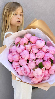 Elegant white peonies in a decorative glass vase, styled for upscale gifting and luxury home décor